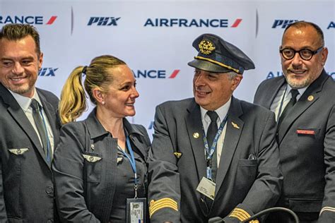 sas and air france crew walking together through paris charles de gaulle airport