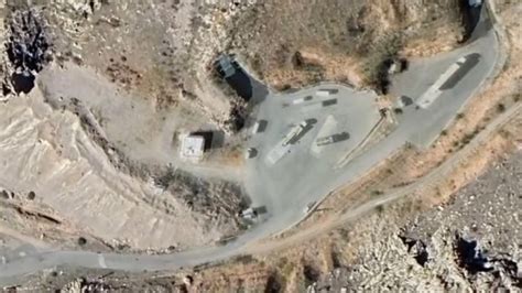 satellite view of mountainous Iranian missile base with tunnel entrances and launch pads