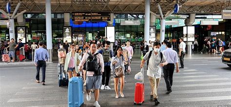 Scandinavian and Vietnamese cabin crew welcoming travelers at Ho Chi Minh City airport