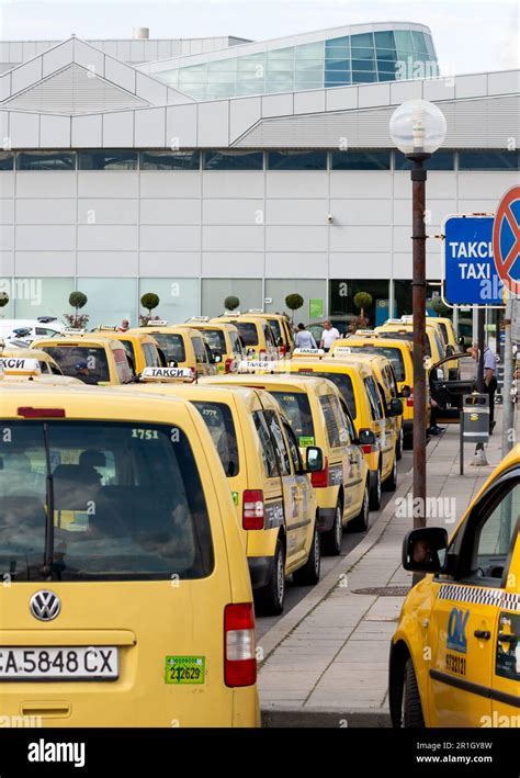 schiphol airport taxi rank with metered official taxis in queue