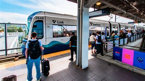 SeaTac/Airport light rail station platform with arriving train