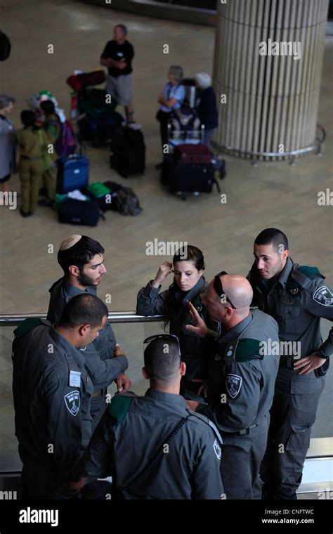security officers at Ben Gurion Airport inspecting newly resumed international flights