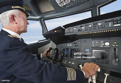 senior airline captain preparing cockpit before retirement era aviation staffing crisis