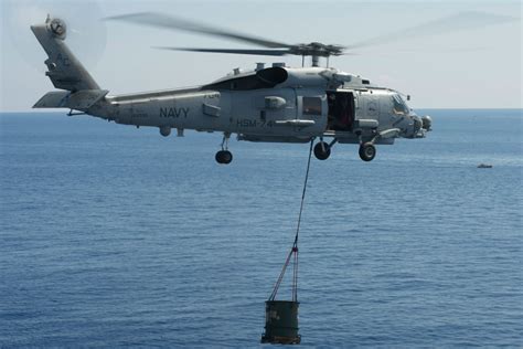 SH-60 Sea Hawk lifting off from a U.S. Navy destroyer