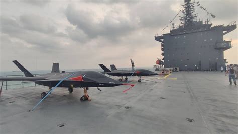 Shahid Bagheri drone carrier docked with deck full of UAVs