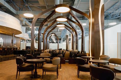 shanyrak business lounge interior with buffet and seating area at almaty airport
