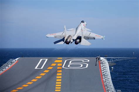 Shenyang J-15 lifting off carrier deck during full-power takeoff
