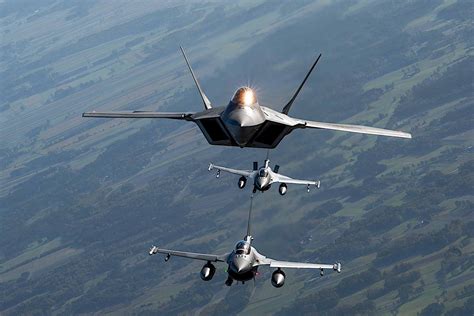 Side-by-side comparison of F-15, F-16, and F-22 in flight formation