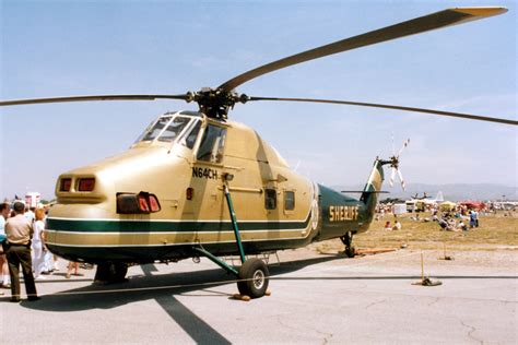 sikorsky s58t preparing for hvac rooftop lift in urban area
