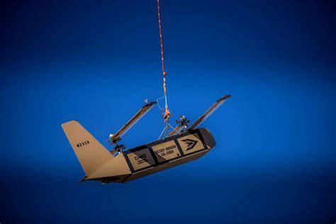 Silent Arrow fixed-wing cargo glider being air-dropped during military exercise