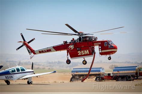 siller helicopters flight line with maintenance crews at sunrise
