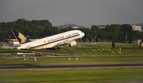 Singapore Airlines A380 at Changi Airport gate with passengers boarding