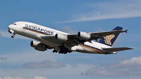 Singapore Airlines A380 departing Auckland Airport at sunset