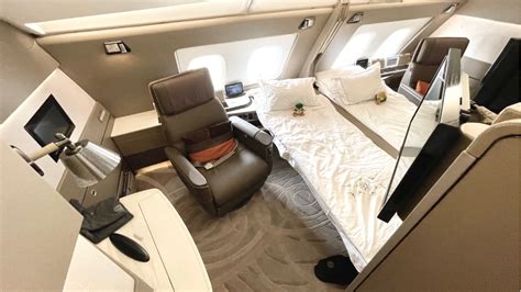 singapore airlines a380 first class suite with bed and armchair