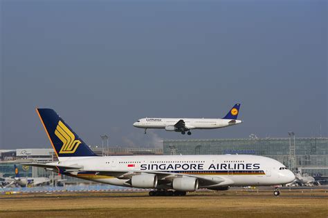 Singapore Airlines A380 taxiing at Frankfurt Airport with winter fog