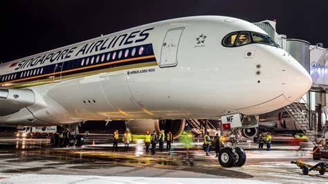 Singapore Airlines Airbus A350-900 at San Francisco International Airport gate at night