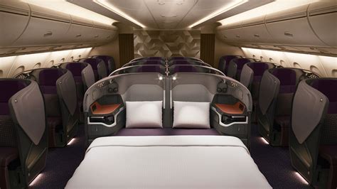 Singapore Airlines Business Class seat transformed into bed with mattress topper