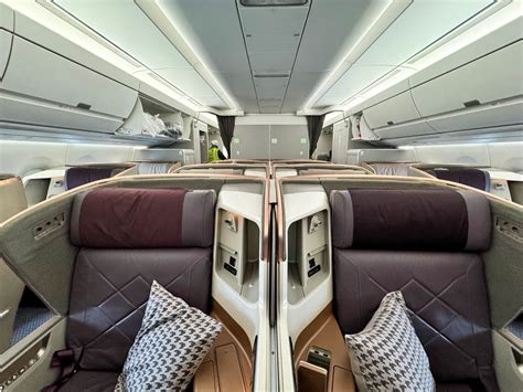 Singapore Airlines business class suite with wide seat and privacy door on Airbus A350 ultra long haul