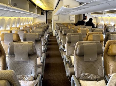 Singapore Airlines economy class cabin night flight atmosphere