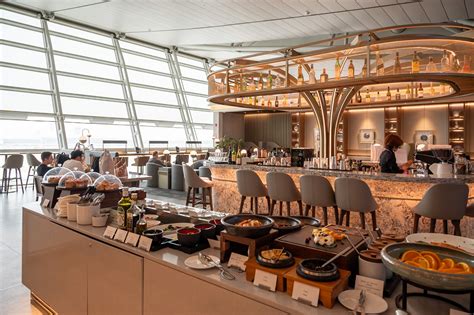 Singapore Airlines SilverKris Lounge dining buffet seating Changi Airport interior