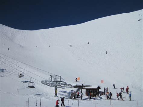 skier overlooking revelation bowl in telluride ski resort