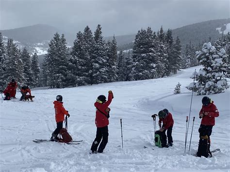 Skiers enjoying fresh powder on Vail Mountain slopes