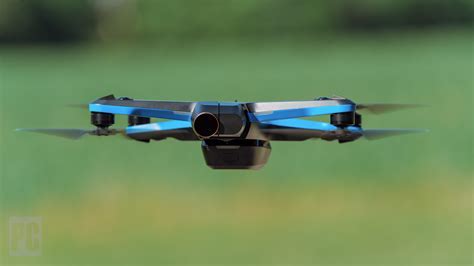 Skydio 2 drone with Beacon accessory highlighted next to a motorcycle helmet