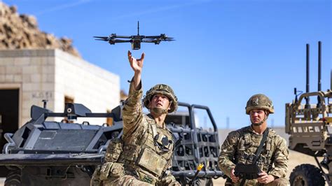 Skydio X2 in autonomous surveillance mode above combat convoy