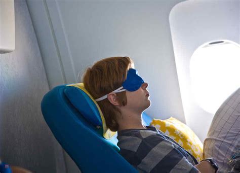 sleepy business traveler disembarking from red eye flight at sunrise