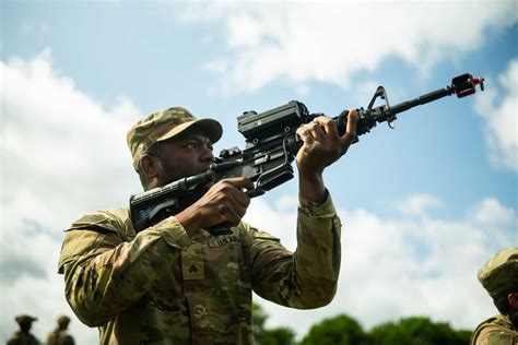 Soldier aiming at aerial drone during night training exercise using SMASH 2000L smart scope
