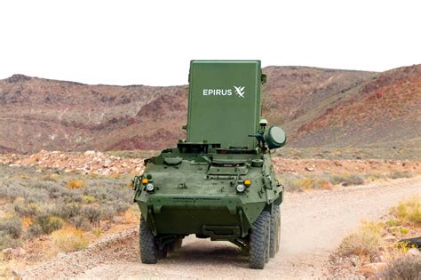 soldier operating Leonidas system console during field test at dusk