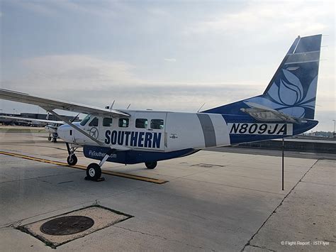Southern Airways Express aircraft on tarmac during stormy weather