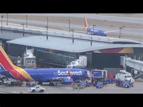 Southwest aircraft taxiing at BWI with terminal in background during winter season