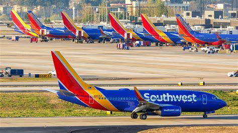 Southwest Airlines aircraft at sunset with passengers boarding unaware of new fare rules