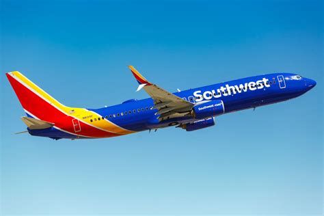 Southwest Airlines Boeing 737 departing Honolulu with Pacific Ocean backdrop