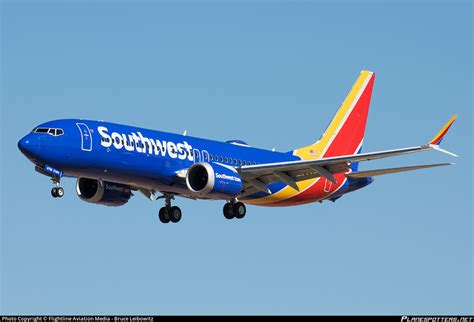 southwest airlines boeing 737 with blue and red livery at sunset