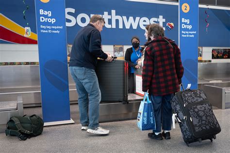 Southwest Airlines check-in counters with baggage fee signage