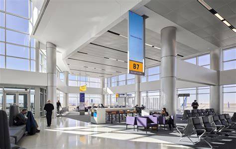 Southwest Airlines Denver International Airport DEN concourse with Boeing 737 aircraft and premium passenger facilities