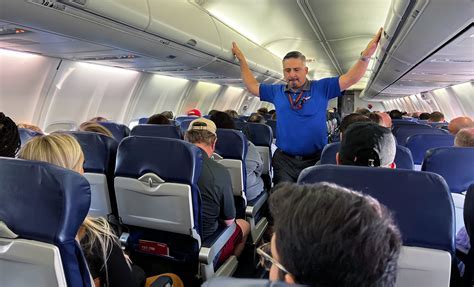 southwest airlines flight attendants boarding passengers at phoenix airport