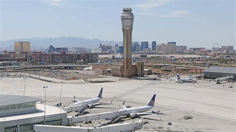 Southwest jet arriving at Las Vegas Harry Reid International Airport with Strip skyline in background