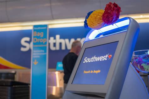 Southwest Rapid Rewards sign at airport kiosk