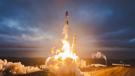 space launch at Vandenberg Space Force Base at dusk with contrail visible