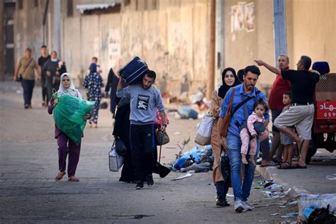 Spanish plaza alive with travelers fleeing conflict zones