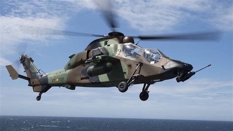 spanish tiger had helicopter on tarmac with missile pods loaded