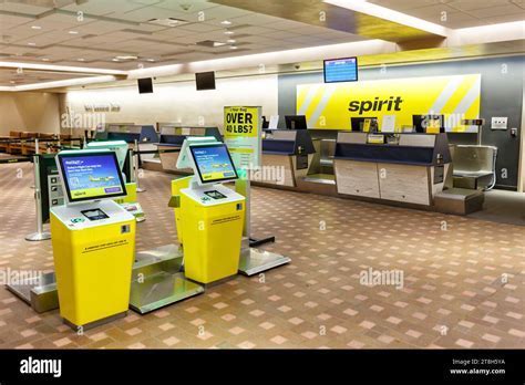 Spirit Airlines check-in counters during spring break traffic at Orlando International Airport
