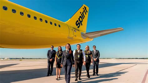 spirit airlines flight attendant smiling cabin in-flight photo