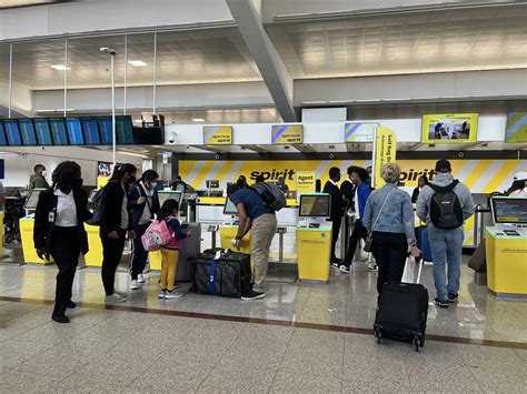 spirit airlines terminal check-in summer travel crowd