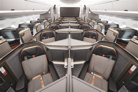 starlux airlines a350 business class suite with doors and premium bedding