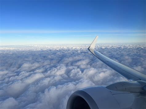 starry sky above clouds viewed from commercial airline cockpit at night