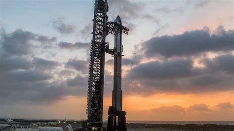 Starship and Super Heavy stacked on launch tower during integrated flight testing